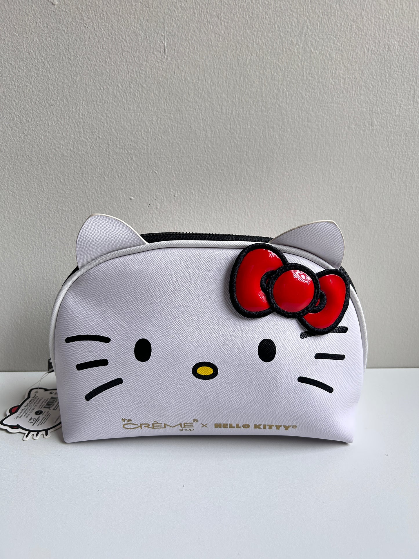 Cosmetiquera Hello Kitty moño rojo