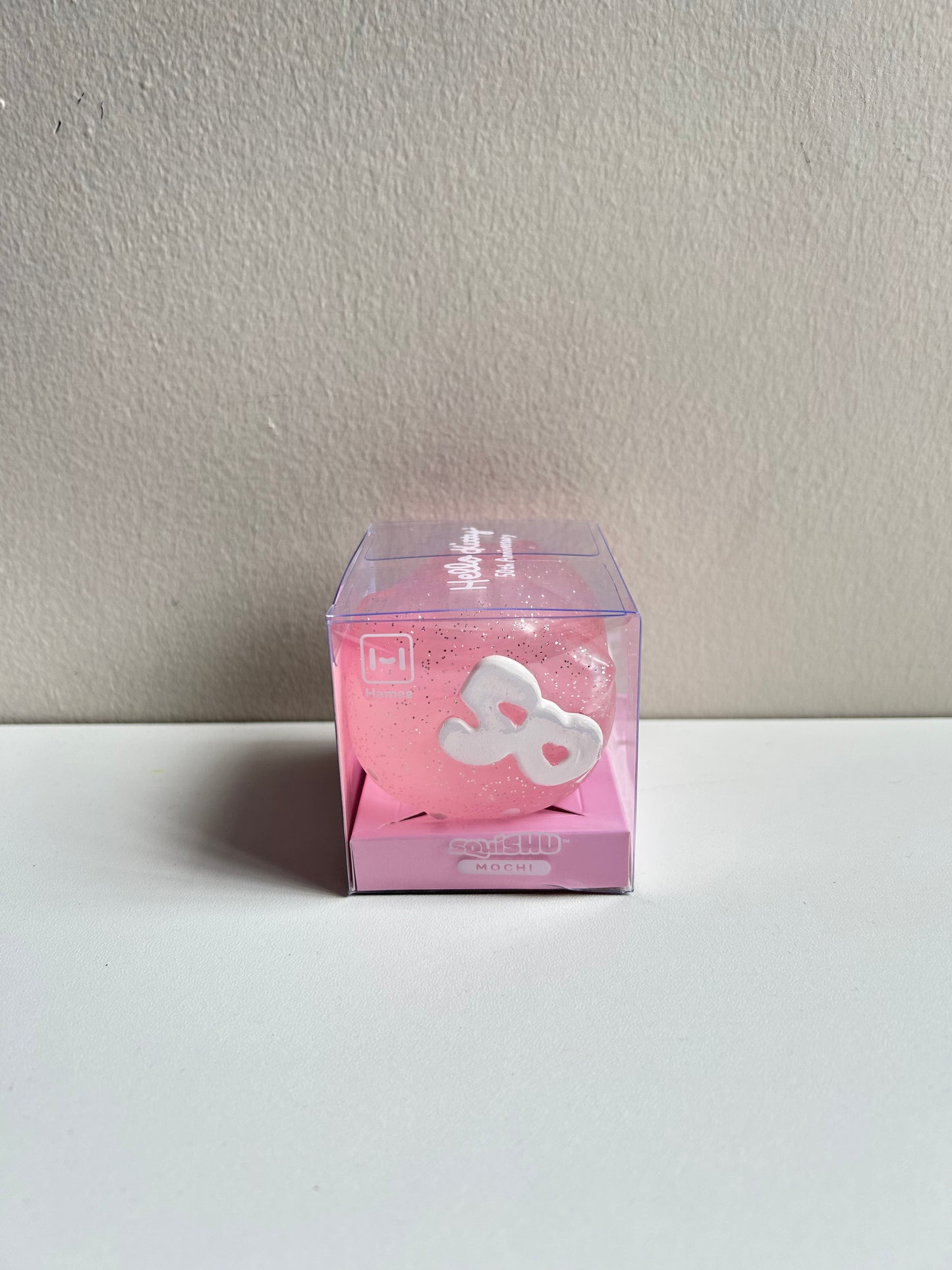 Hamee SquiSHU Sanrio Hello Kitty 50th Anniversary Rosa con brillitos